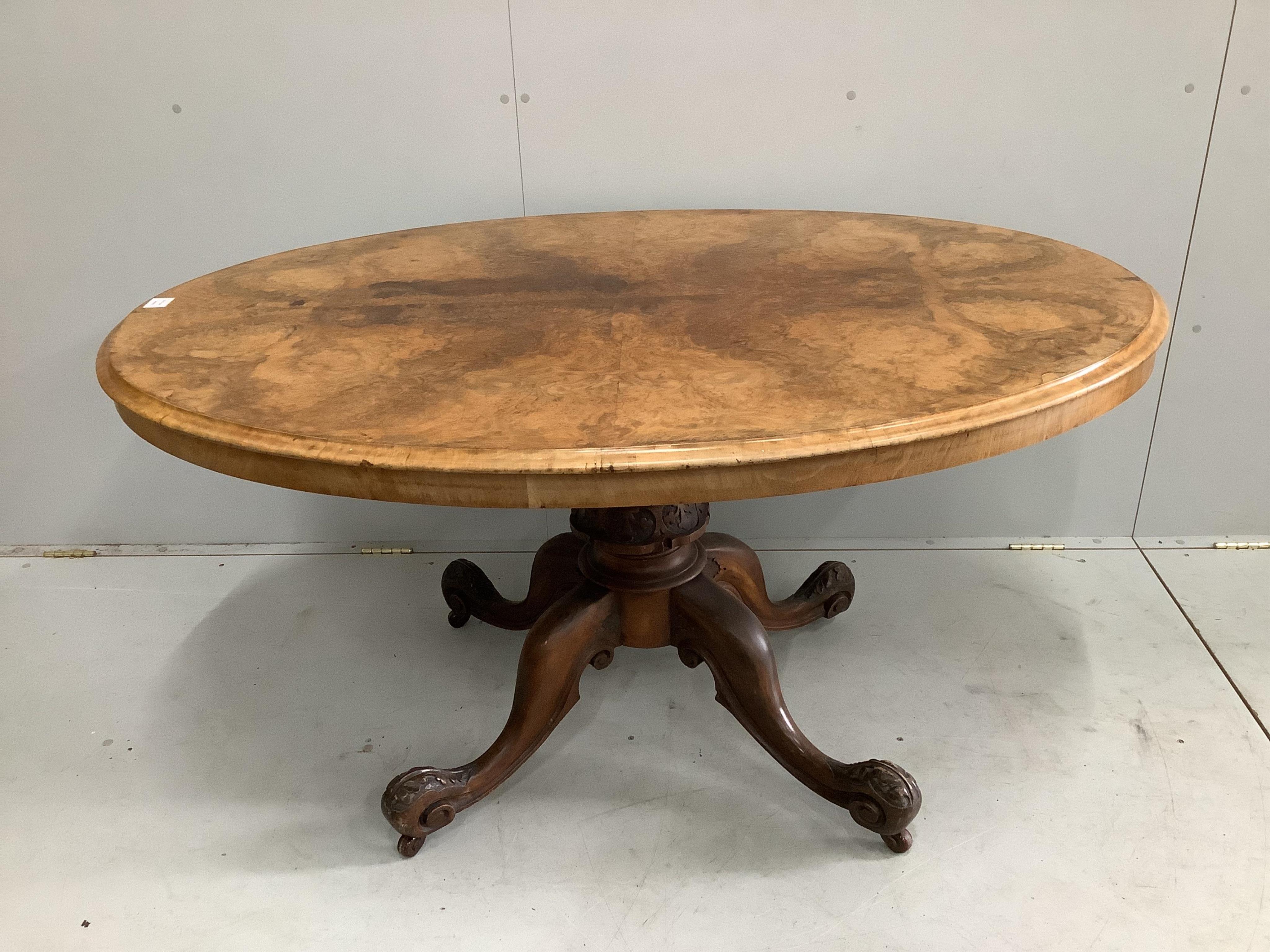A Victorian figured walnut oval tilt top loo table, width 142cm, depth 104cm, height 72cm, together with a set of four late Victorian walnut dining chairs. Condition - fair